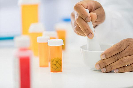 Pharmacist consulting patient